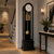 Enfilade avec corps noir, cadran blanc et tiges de pendule dorées