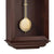 Horloge murale en bois avec boule de pendule dorée et fines montants en laiton