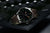 Montre homme avec lunette en acier inoxydable et bracelet en cuir marron, chiffres luminescents