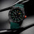 Bracelet de montre pour homme avec cadran vert, aiguilles lumineuses, boîtier noir et bouton rouge