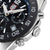 Taucheruhr-Detail mit geriffelter Lünette, Krone und Datum 31 am schwarzen Zifferblatt