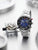 Zeppelin Herrenuhr mit blauem Zifferblatt, Edelstahlarmband und rotem Kronenschutz