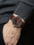Zeppelin Chronograph am Handgelenk, dunkelrotes Lederarmband, mehrere Chrono-Zähler