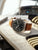 Zeppelin Herrenuhr Chronograph seitliche Ansicht, braunes Lederarmband, dunkles Zifferblatt