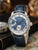 Herrenautomatik-Uhr mit blauem Zifferblatt, römischen Stundenmarkierungen und Lederarmband