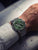 Herrenuhr am Handgelenk mit grünem Zifferblatt, Chronograph und Metallmaschenband