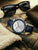 Herrenuhr Zeppelin Chronograph mit blauem Lünette-Tachymeter, weißem Zifferblatt, Lederarmband