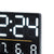 Gros plan d'un écran LED d'une montre numérique, noir, affichant l'heure et la température/humidité.