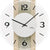 Wanduhr im Detail: weißes Zifferblatt mit schwarzen Ziffern, AMS-Logo und Holz-Glas-Optik